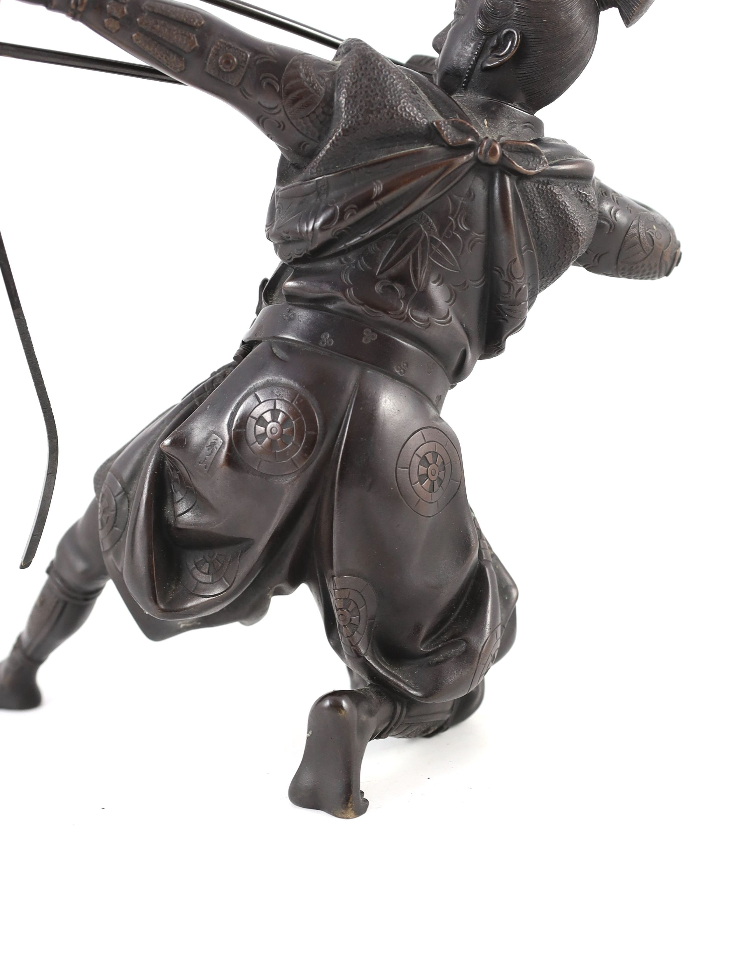 A Japanese bronze figure of a kneeling archer, Meiji period, 40 cm high